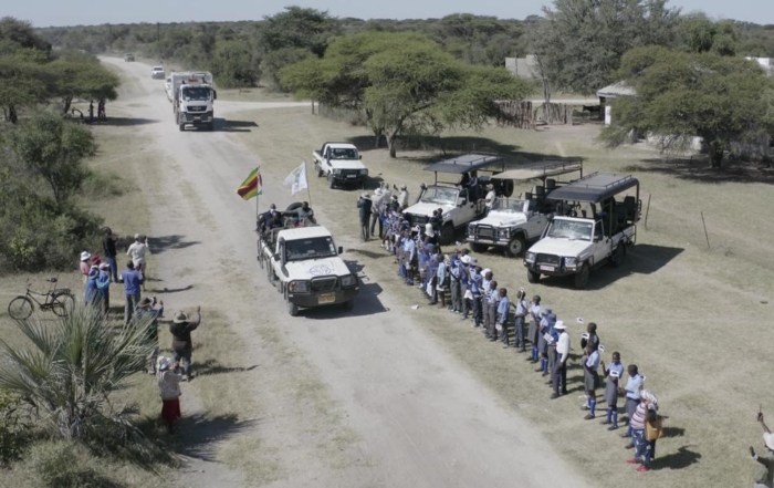 Community line up to greet the first 2 white rhinos 2022